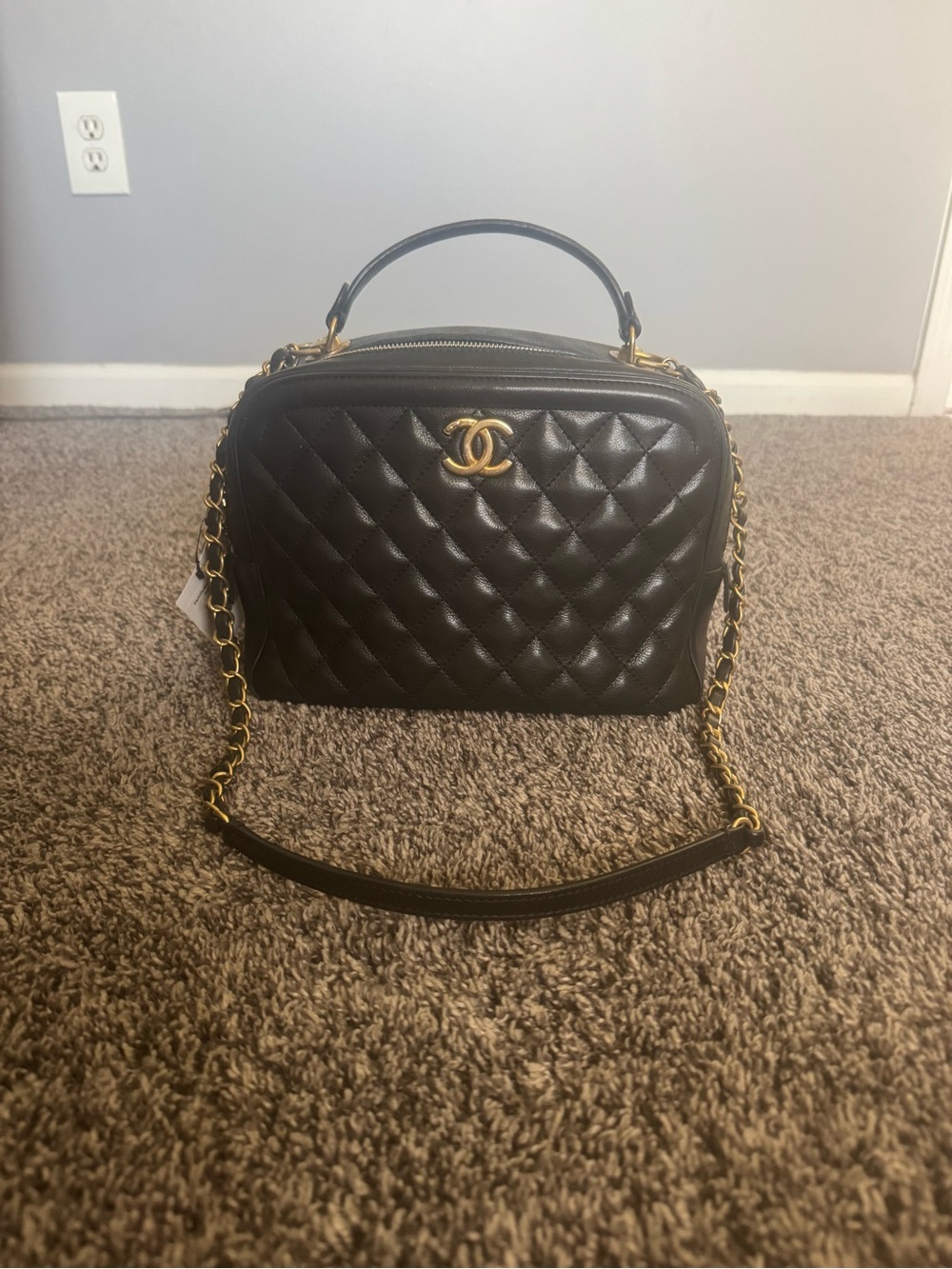 CHANEL Calfskin Quilted CC Vanity Case in black with gold hardware